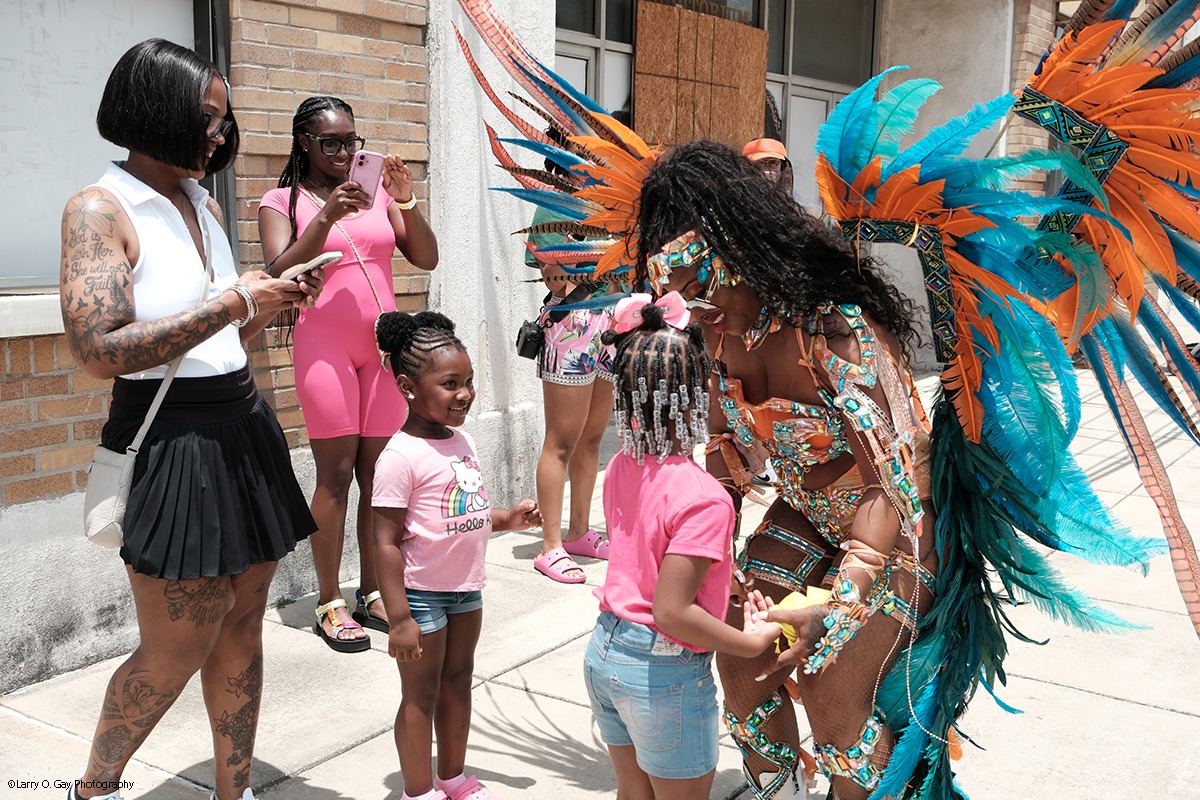 Festival volunteer interacting with children
